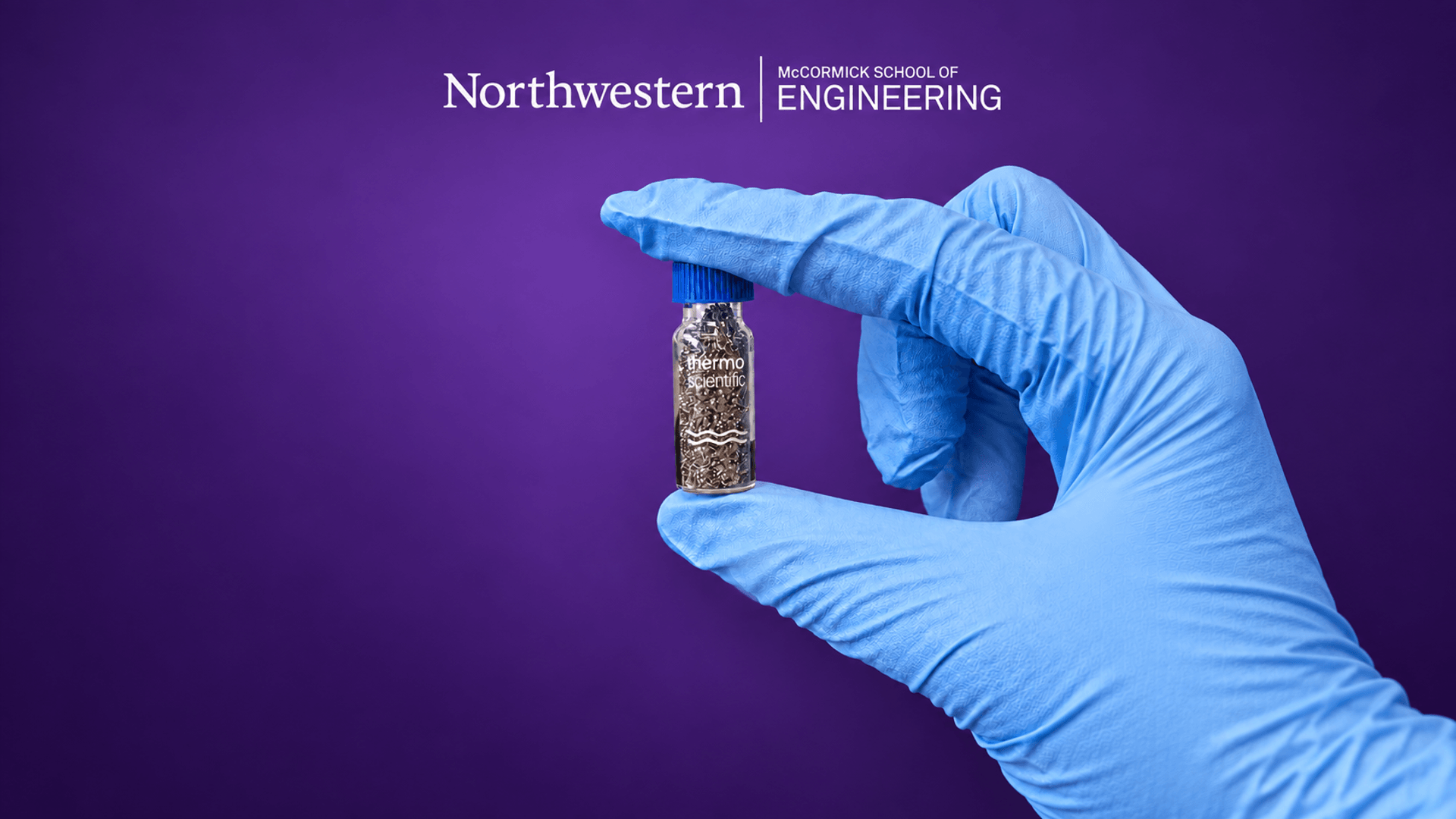 Northwestern Engineering title image with a gloved hand holding a vial of metallic alloy particles
